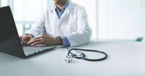 doctor-office-medical-practice-doctor-on-laptop